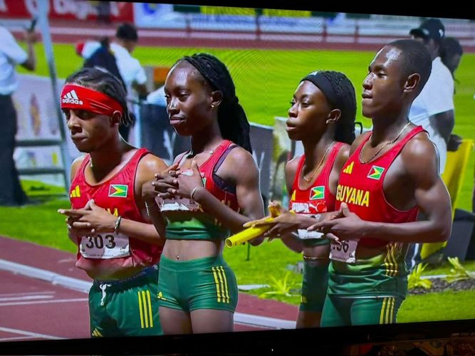Storied Company! The quartet (from left) of Dhanielson Gill, Narissa McPherson, Tianna Springer, and Malachi Austin pose for the cameras after smashing the 4x400m mixed relay record en route to gold.