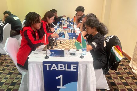 Guyana’s youngest player, 13-year-old Aditi Joshi (right), in action at the CARICOM Classic Chess Tournament.
