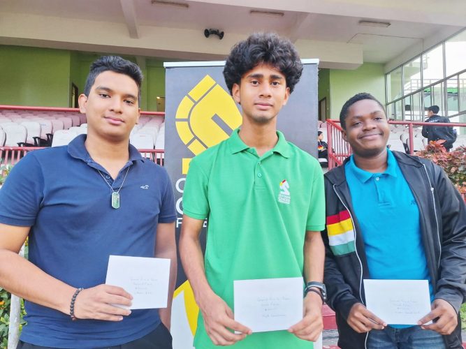 The open category winner, Kyle Couchman (centre), is flanked by runner-up Ethan Lee (left) and third-placed Keron Sandiford (right).