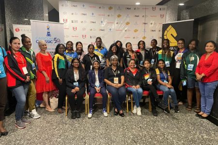 The female players and officials from the competing teams posed for a photo opportunity yesterday ahead of the start of play in honour of today’s International Women’s Day