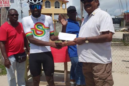 Three in three! Briton John receives his winner’s prize after dominating the first stage of the Jagan’s Memorial Cycling Road Race.