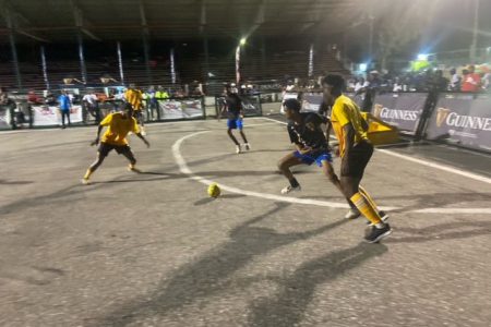Part of the action in the Guinness ‘Greatest of the Streets’ Georgetown edition between Young Gunners (yellow) and Lodge