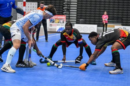 Surrounded! Andrew Stewart (left), Robert France (centre), and Tahrea Garnett (right) surround Argentina’s Joaquin Gonzalez in the Indoor Pan American Cup