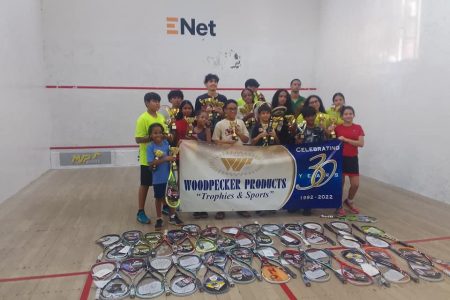 The respective group winners and top three finishers pose with their spoils at the conclusion of the Woodpecker Squash Championship