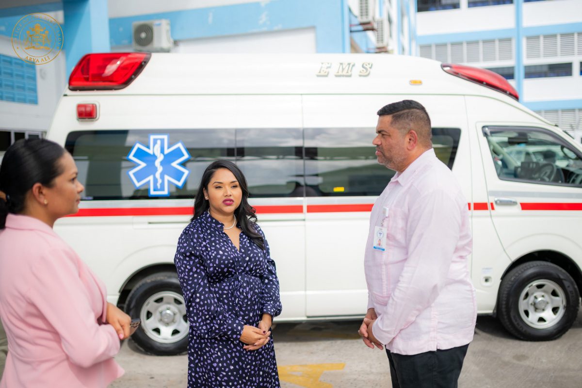 First Lady Arya Ali (centre) with the ambulance in the background (DPI photo)