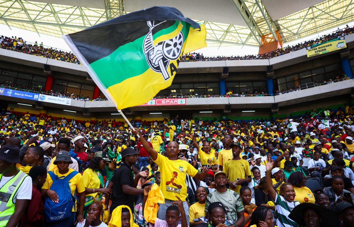 An African National Congress (ANC) supporter waves a flag during the 112th anniversary celebrations of the founding of the party, at Mbombela Stadium in Mpumalanga province, South Africa, January 13, 2024. REUTERS/Siphiwe Sibeko/File Photo