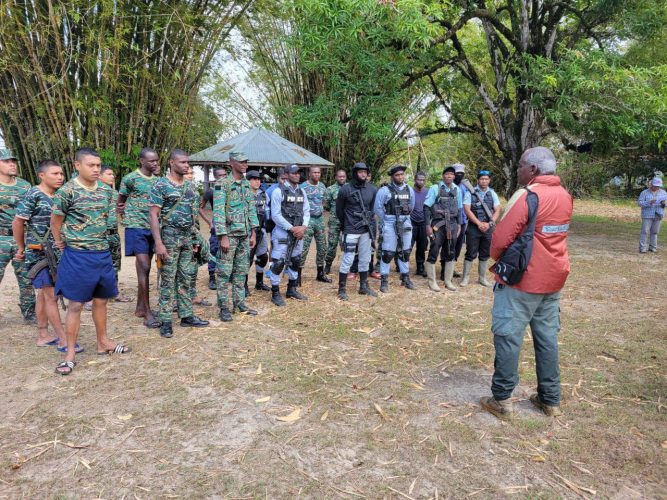 Minister Robeson Benn addressing the Joint Services team (Ministry of Home Affairs photo)