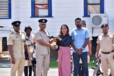 Deputy Commissioner ‘Administration’, Calvin Brutus (third from left) receiving the keys (Police photo)