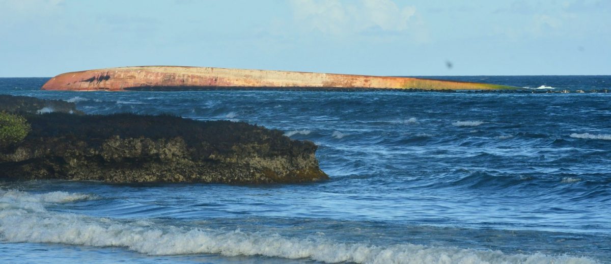 FILE: The overturned Gulfstream barge involved in the recent oil spill off the coast of Tobago.