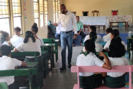 Chief Labour Officer,  Dhaneshwar Deonarine speaking to the students (Ministry of Labour photo)