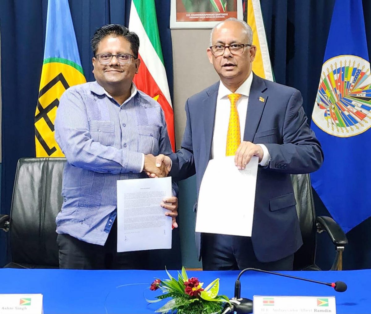 Minister of Finance Dr Ashni Singh (left) and Suriname’s Minister of Foreign Affairs, International Business and International Cooperation, Albert Ramdin yesterday (Ministry of Finance photo)