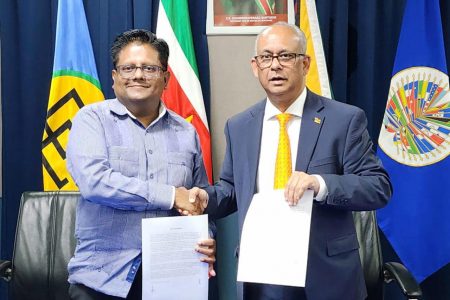 Minister of Finance Dr Ashni Singh (left) and Suriname’s Minister of Foreign Affairs, International Business and International Cooperation, Albert Ramdin yesterday (Ministry of Finance photo)