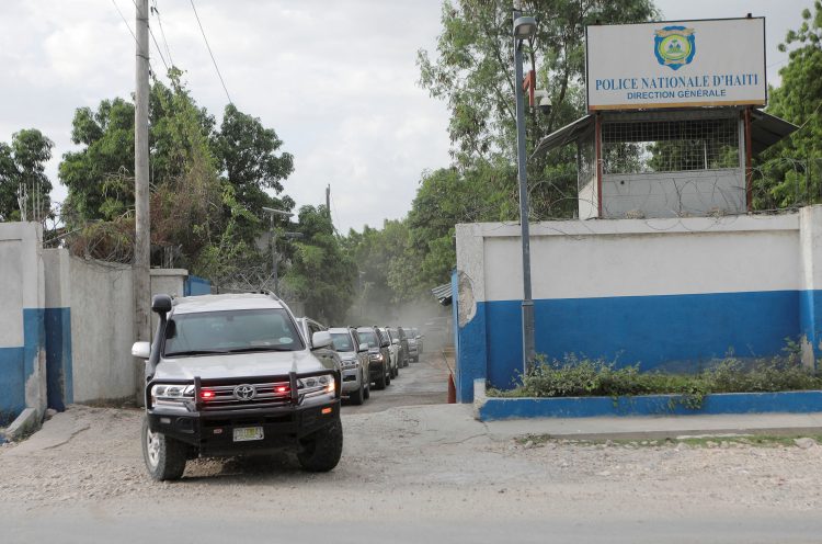 FILE PHOTO: A convoy of cars carrying members of a Kenyan delegation leave the premises of Haitian National Police (PNH) after meeting with the Chief of the Haitian National Police Frantz Elbe, in Port-au-Prince, Haiti, August 21, 2023. REUTERS/Ralph Tedy Erol/File Photo