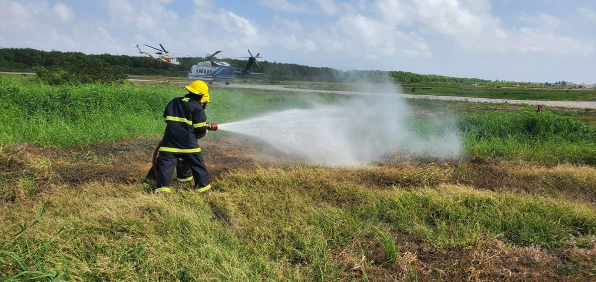 The recent aircraft fire-fighting and rescue drill, conducted by fire-fighters at EFCIA, Ogle showcased the firefighters’ preparedness and expertise in handling emergency situations within the aviation sector. This drill involved comprehensive training exercises that simulated various scenarios such as aircraft fires, crash landings, rescues, and other potential emergencies. (Guyana Fire Service photo)