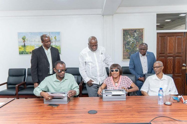 Prime Minister Mark Phillips (standing at centre) with members of the Society and ministry officials. (Office of the Prime Minister photo)