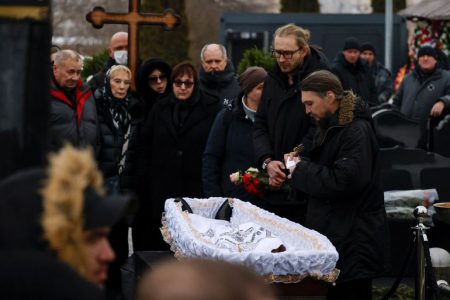 MOSCOW,  (Reuters) - Thousands of Russians chanted Alexei Navalny’s name and said they would not forgive the authorities for his death as the opposition leader was laid to rest in Moscow on Friday.
At a cemetery not far from where Navalny once lived, his mother Lyudmila and father Anatoly stooped over his open coffin to kiss him for the last time as a small group of musicians played.
Crossing themselves, mourners stepped forward to caress his face before a priest gently placed a white shroud over him and the coffin was closed.
Navalny, President Vladimir Putin’s fiercest critic inside Russia, died at the age of 47 in an Arctic penal colony on Feb. 16., sparking accusations from his supporters that he had been murdered. The Kremlin has denied any state involvement in his death.
The authorities have outlawed his movement as extremist and cast his supporters as U.S.-backed troublemakers out to foment revolution. Kremlin spokesman Dmitry Peskov said he had nothing to say to Navalny’s family.
Many thousands of people turned out to pay their respects at the cemetery and earlier outside the Soothe My Sorrows church in southeast Moscow where the funeral took place.
Among the large crowd, many people clutched bunches of flowers and some joined in a series of chants - “Russia will be free”, “No to war”, “Russia without Putin”, “We won’t forgive” and “Putin is a murderer”.
Police were present in large numbers but for the most part did not intervene. A rights group, OVD-Info, reported six people had been detained in Moscow and at least 39 in other parts of Russia.
“There are more than 10,000 people here, and no one is afraid,” said a young woman, Kamila, in the crowd. “We came here in order to honour the memory of a man who also wasn’t afraid, who wasn’t afraid of anything.”
Kirill, 25, said: “It’s very sad for the future of Russia... We won’t give up, we will believe in something better.”
Public demonstrations in Russia are risky and rare, especially since the start of the war in Ukraine that the Kremlin calls a “special military operation”. More than 20,000 people have been detained in the past two years.
Despite Friday’s high turnout and flashes of defiance, Navalny’s death leaves Russia’s fragmented opposition in an even more precarious position as Putin prepares to extend his 24-year rule by another six years in an election this month. All of the president’s leading critics are behind bars or have fled the country.
Even from prison, Navalny had cheered his supporters with displays of resilience and humour in his frequent legal hearings and social media posts. His death leaves many feeling bereft.
“I want to do what Navalny told us to and not give up but I don’t know what to do right now,” said one young man in the crowd.
On a memorial website, more than 140,000 people lit “virtual candles” for Navalny. It was unclear how many of those were inside Russia.
MOTHER’S STRUGGLE
Navalny’s mother Lyudmila, 69, had travelled to the “Polar Wolf” penal colony after his death and battled with authorities for a week to get them to release his body. She accused them of putting pressure on her to bury him without a public funeral, something the Kremlin denied.
The service was brief, and took place in a church whose worshippers had raised funds to buy drones and other equipment to support Russian soldiers in the Ukraine war that Navalny condemned as an act of madness by Putin.
Inside, Lyudmila was pictured seated and holding a candle as priests in white robes stood over her son’s coffin.
“This is a photograph that is very hard to look at,” said Ruslan Shaveddinov, co-host of a livestreamed event by Navalny aides now based outside Russia, who struggled to contain their emotions as the pictures and footage rolled in.
State media gave scant coverage to the funeral. The RIA news agency reported the fact of Navalny’s burial, noting the presence of foreign envoys including the U.S., French and German ambassadors, and recalled that he had been jailed on a host of charges including fraud, contempt of court and extremism.
Navalny denied all those charges, saying they had been trumped up by the authorities to silence his criticism of Putin.
More than a quarter of a million people watched the farewell to Navalny on his YouTube channel, which is blocked inside Russia. Messages, mostly expressing sadness but some also defiance, streamed down beside the video.
Allies of Navalny outside Russia have called on people who want to honour his memory but could not attend his funeral service to instead go to memorials to Soviet-era repression in their own towns on Friday evening at 7 p.m. local time.
The Kremlin said any unsanctioned gatherings in support of Navalny would violate the law and those who took part would be held accountable.
Navalny’s wife Yulia and two children, who are living outside Russia, did not attend the funeral.
Yulia Navalnaya, who has pledged to continue her husband’s work, thanked him for “26 years of absolute happiness”.
She posted on X: “I don’t know how to live without you, but I will try my best to make you up there happy for me and proud of me. I don’t know if I’ll manage it or not, but I will try.”
Navalny, a former lawyer, mounted the most determined political challenge against Putin since the Russian leader came to power at the end of 1999, organising street protests and publishing high-profile investigations into the alleged corruption of some in the ruling elite.
Navalny decided to return to Russia from Germany in 2021 after being treated for what Western doctors said was poisoning with a nerve agent only to be immediately taken into custody.
Putin has yet to comment on Navalny’s death and has for years avoided mentioning him by name.
