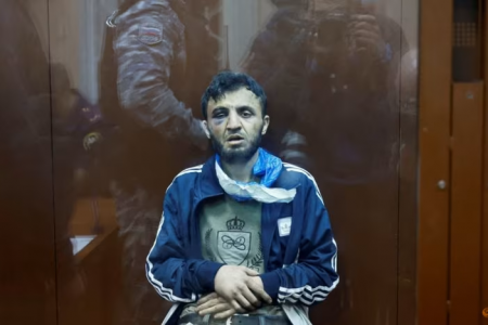 Dalerdzhon Mirzoyev, a suspect in the shooting attack at the Crocus City Hall concert venue, sits behind a glass wall of an enclosure for defendants at the Basmanny district court in Moscow, Russia, on Mar 24, 2024. (Photo: REUTERS/Shamil Zhumatov)