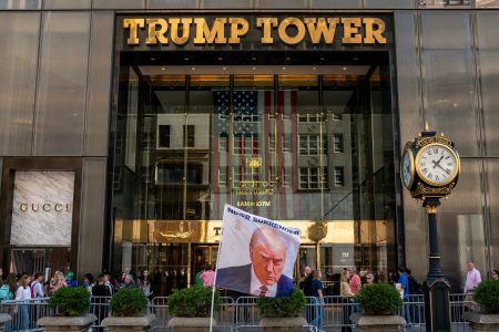 FILE PHOTO: A flag depicting former U.S. President Donald Trump is placed at Trump Tower in New York City, U.S., October 1, 2023.REUTERS/David ‘Dee’ Delgado/File Photo