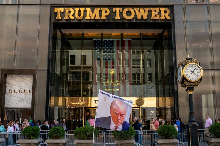 FILE PHOTO: A flag depicting former U.S. President Donald Trump is placed at Trump Tower in New York City, U.S., October 1, 2023.REUTERS/David 'Dee' Delgado/File Photo