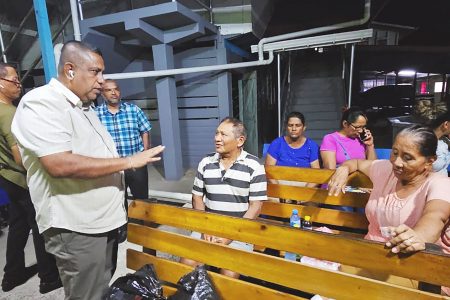 Regional Vice Chairman, Zamal Hussain (standing) meeting with relatives of the injured persons at the Skeldon Hospital last evening.