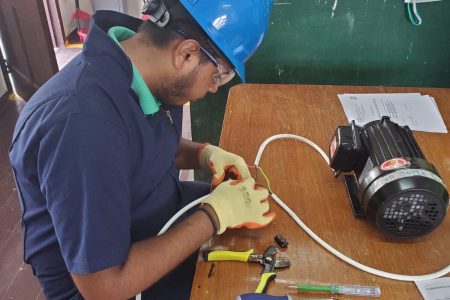 The 18-year-old during his TVET programme learning electrical installation 
