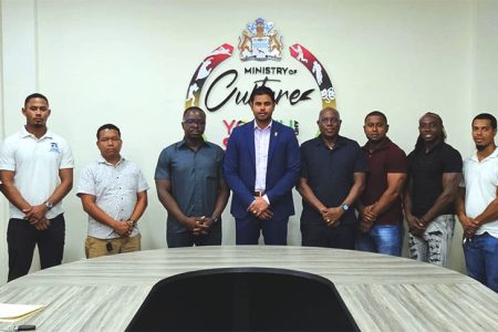 Minister of Culture, Youth and Sport Charles Ramson Jr (centre) and Director of Sports Steve Ninvalle (5th from right) posing with members of the GBBFF Executive Committee following the meeting
