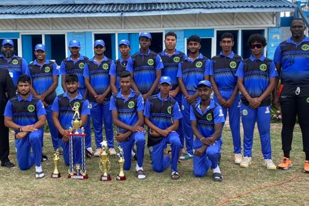 The victorious Demerara U-19 side dethroned Berbice as the GCB U-19 50-Over champions. In the photo, GCB President Bissoondyal Singh (2nd from left) and Cricket Operations Manager Anthony D’Andrade (right) pose with the team and their spoils