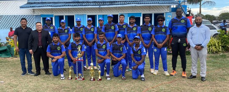 The victorious Demerara U-19 side dethroned Berbice as the GCB U-19 50-Over champions. In the photo, GCB President Bissoondyal Singh (2nd from left) and Cricket Operations Manager Anthony D’Andrade (right) pose with the team and their spoils