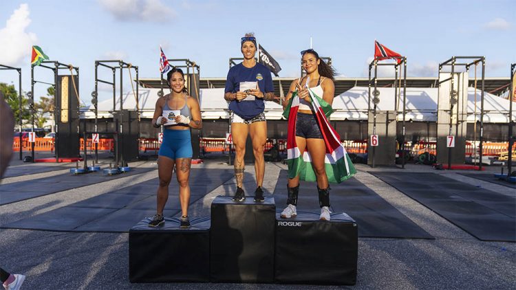 Bryleigh Hansen (centre) of the United States of America is
flanked by Suriname’s Ava Zalman (right) and Heather Dudson
of the USA after winning the Women’s Rx division.