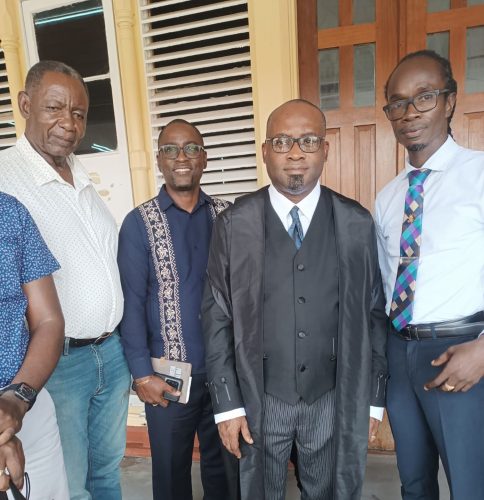 GTU President Mark Lyte (second, left) is all smiles following the victory handed down to the union by the court on Friday. With him are Lincoln Lewis (left), Roysdale Forde (second, right), and Julian Cambridge (right).