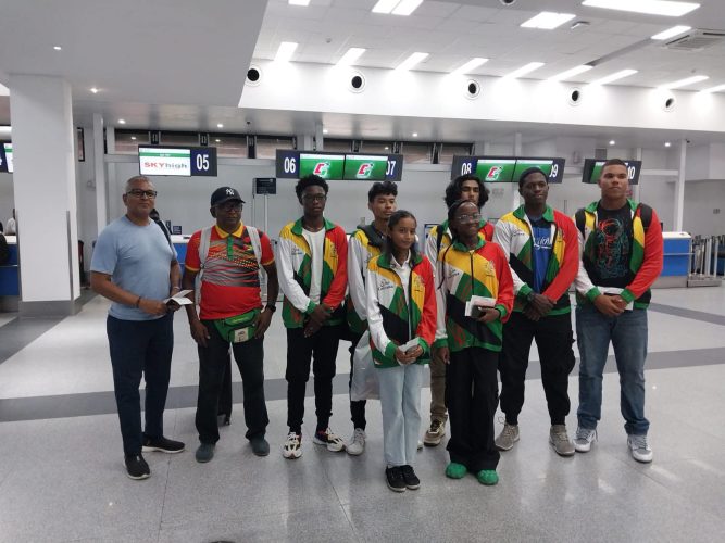 The Guyanese contingent of (L-R Back Row) Ramdeo Kumar, Coach Linden Johnson, Malachi Moore, Colin Wong, Krystian Sahadeo, Umar Percival, Jonathan Van Lange, (L-R Front Row) Samara Sukhai, and Akira Watson pose for a photo prior to their departure from the CJIA.