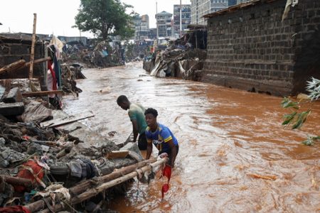 Residents sift through the rubble as they recover their belongings after the Nairobi river burst its banks and destroyed their homes within the Mathare Valley settlement in Nairobi, Kenya April 25. REUTERS/Monicah Mwangi
