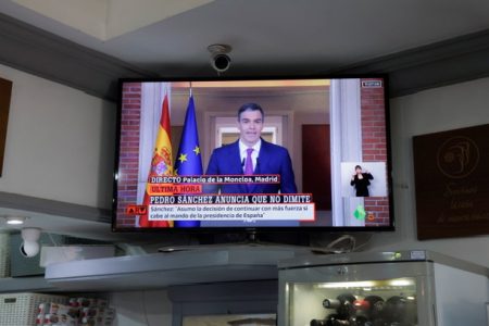 A TV broadcasting shows a statement by Spain's Prime Minister Pedro Sanchez in a bar, in Ronda, Spain, April 29, 2024. REUTERS/Jon Nazca