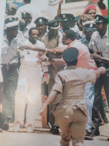Laramania! Brian Lara is protected by a cordon of Antiguan
policemen moments after he passed Sir Garry Sobers’ Test
record of 365 (Source: Red Stripe Caribbean Cricket Quarterly
Volume 4 Number 3, July/September, 1994)
