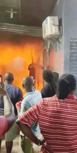Onlookers during the raging fire at the Mackenzie market stall 
