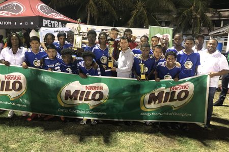 Victory! Chase Academy receives the championship trophy for the fourth time as they defeated Waramuri of Region #1 in the Milo Secondary Schools Football Final.
