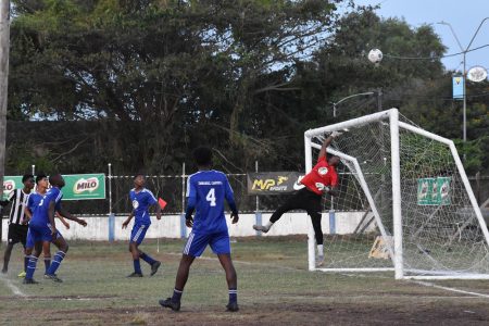 A picture from the Milo Secondary School Football Championship fixture between Chase Academy (blue) and President’s College
