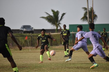 Part of the action in the Milo Schools Football Championship between Anns Grove (black) and Waramuri
