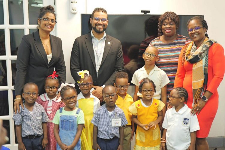 Nursery school pupils posing with their new spectacles
