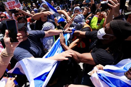 Protesters in support of Palestinians in Gaza and pro-Israel counter-protesters scuffle during demonstrations amid the ongoing conflict between Israel and the Palestinian Islamist group Hamas, at the University of California Los Angeles (UCLA) in Los Angeles, California, U.S. April 28, 2024.