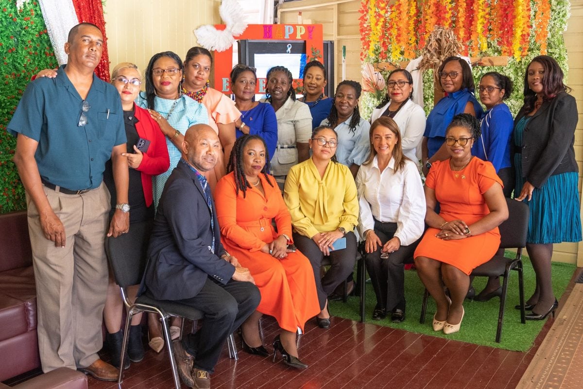 The officers who were part of the training strike a pose with the facilitator Majorie Solorzano, second from right in front row.  (Ministry of Education photo)