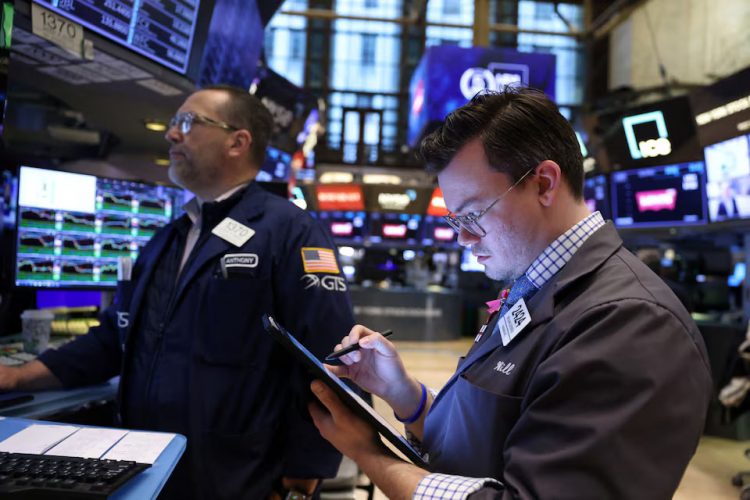 Traders work on the trading floor at the New York Stock Exchange (NYSE) in New York City, U.S., April 5, 2024.