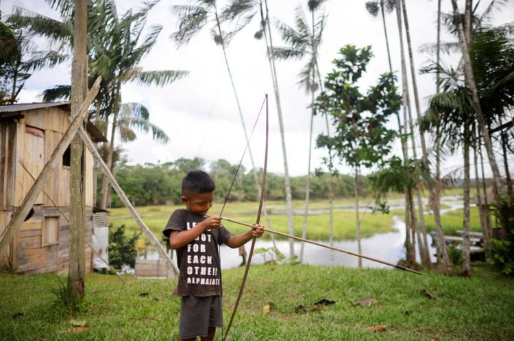 A boy with a bow and arrow (Reuters photo)