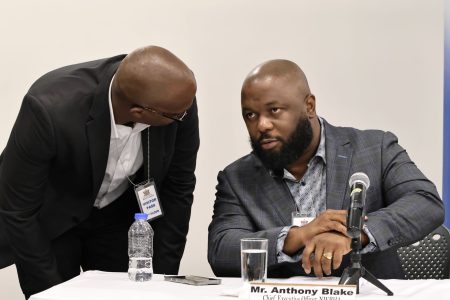 NWRHA CEO Anthony Blake listens attentively to head of the Port-of-Spain General Hospital’s NICU, Dr Marlon Timothy, during a media conference at the Ministry of Health in Port-of-Spain yesterday.