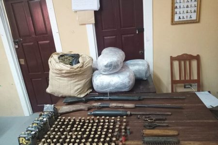 The cannabis, guns, and ammo discovered during the eradication exercise