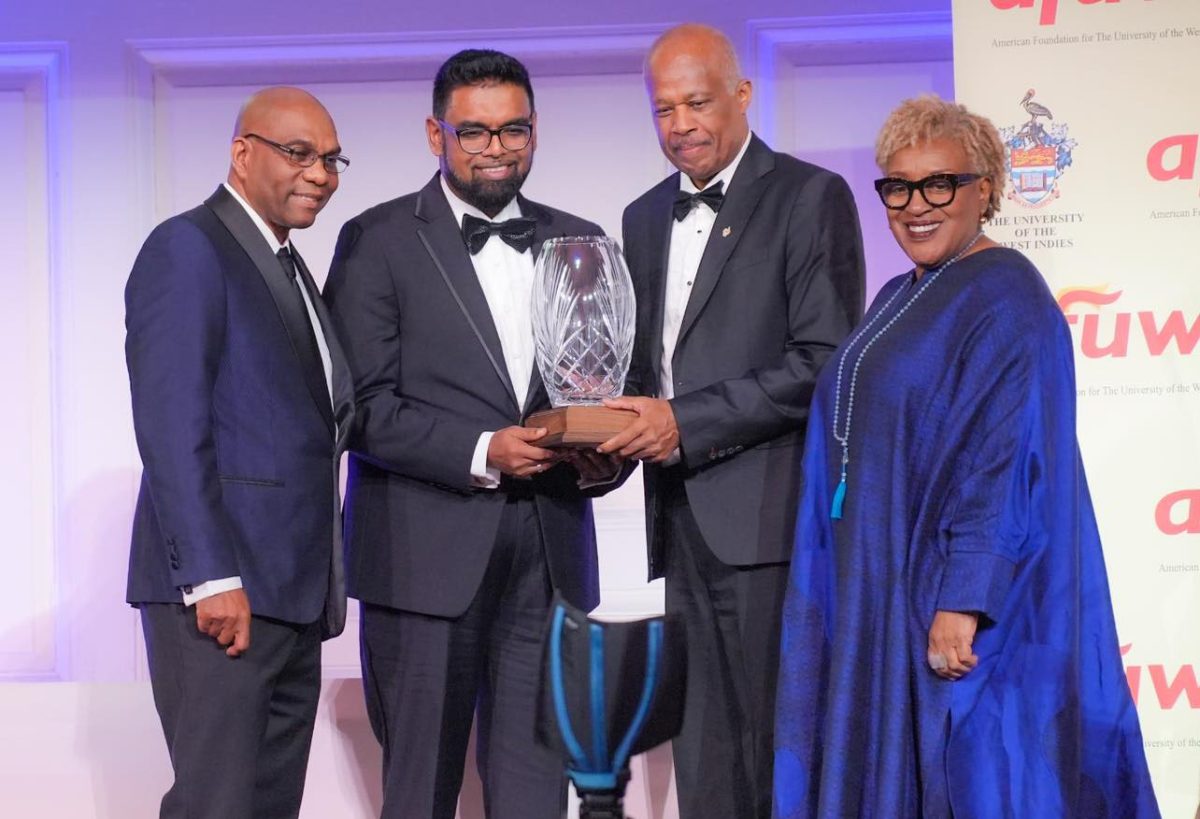 President Irfaan Ali (second from left) with Sir Hilary Beckles (second from right) and CCH Pounder (right) (Office of the President photo)
