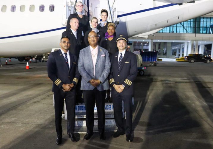 Public Works Minister Juan Edghill (centre) with the flight crew (CJIA photo)