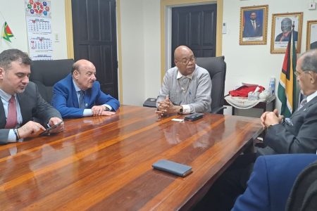 The  meeting. Minister of Public Works Juan Edghill is at the head of the table.  (Ministry of Public Works photo)