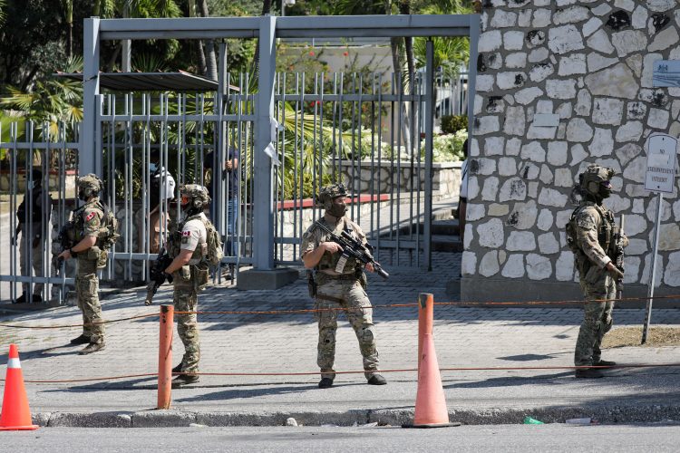 FILE PHOTO: Canadian soldiers stand guard by the Canadian embassy as violence spreads and armed gangs expand their control over the capital, in Port-au-Prince, Haiti March 29, 2024. REUTERS/Ralph Tedy Erol/File Photo