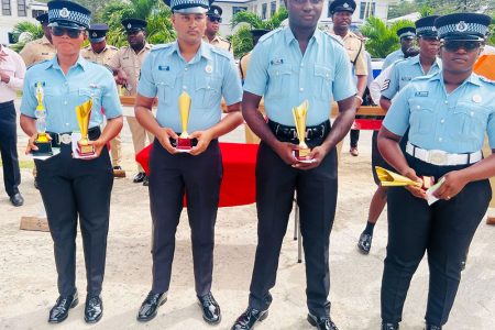 Some of the awardees with their trophies (Photo courtesy of the Guyana Police Force)